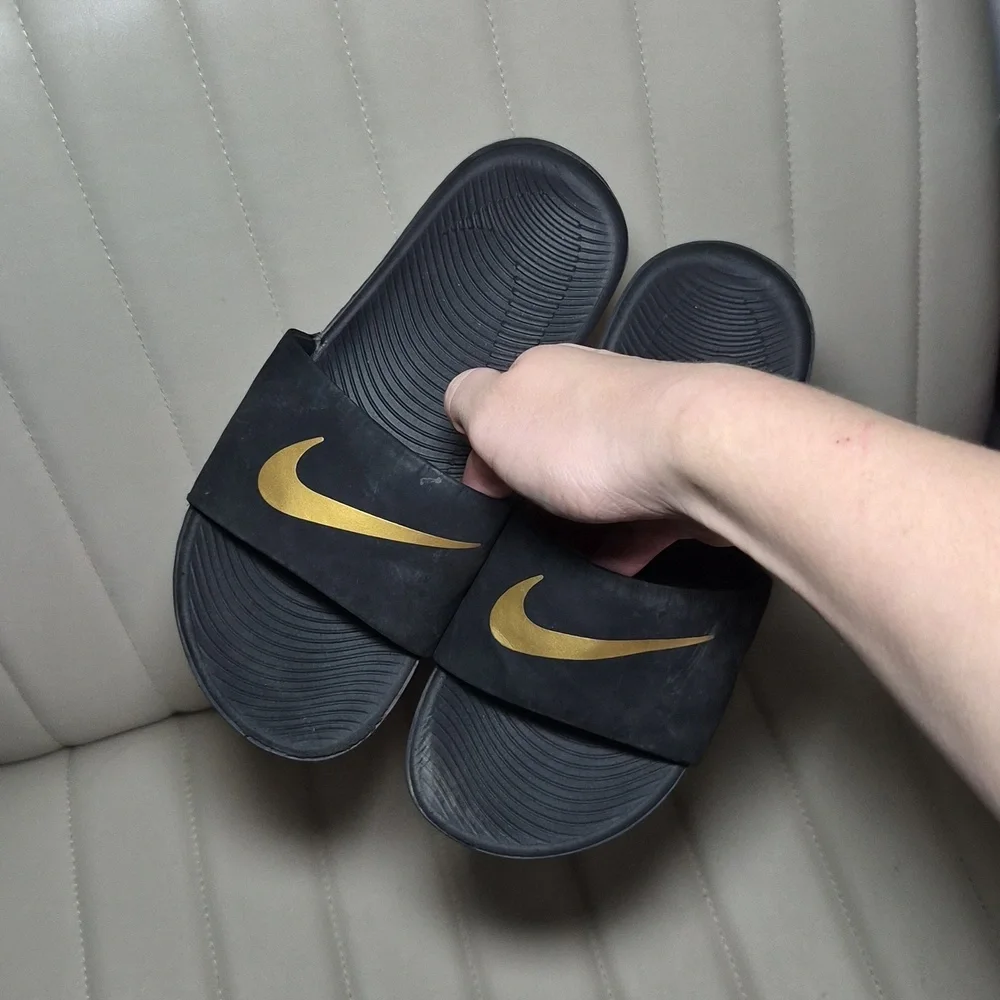 Nike Black Slides with Gold Swoosh 2Y